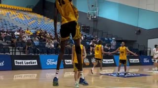 7'6" 17-year-old Jongkuch "JK" Mach dunking a ball in warmups