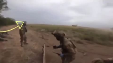 An artillery shell explodes close to Ukrainian soldiers, shrapnel misses the group by ca. 1 meter