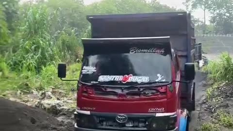 Full gas truck passing through narrow roads