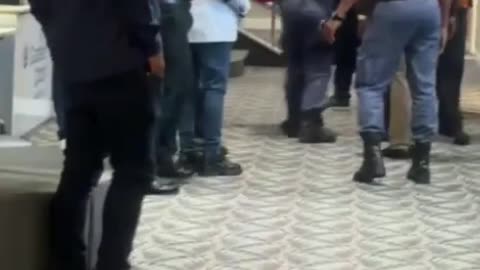 Fist fight: Ivan Barnes fighting with Mbali Shinga's supporters