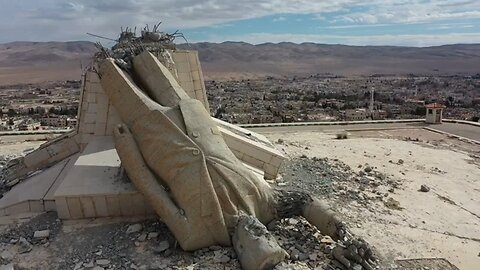 Rebels topple largest statue of Hafez Al Assad in Syria