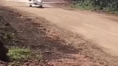 Airplane take off from road in the jungle of Guatemala