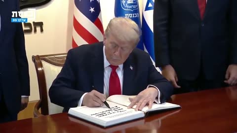Trump signs the guestbook at the Knesset in Jerusalem