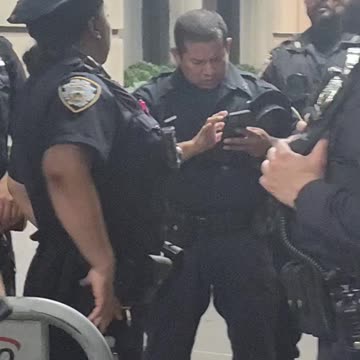 NYPD officers protecting war criminal Benjamin Netanyahu.