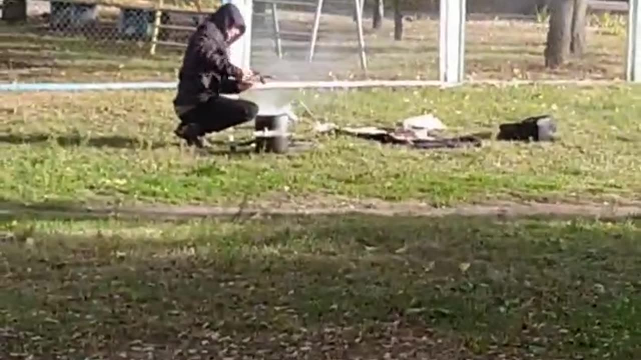 In Kyiv, a Man Cooks on an Open Fire — Just Like Before the Communists…