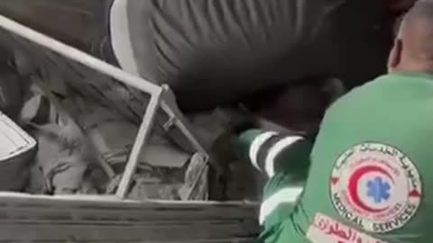 Rescue teams continue digging with their bare hands to save civilians trapped under the rubble