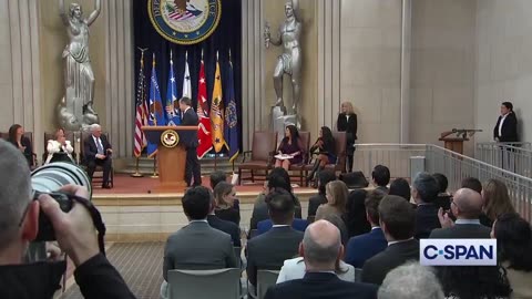 Christopher Wray gives Merrick Garland a Tommy Gun as a going away present