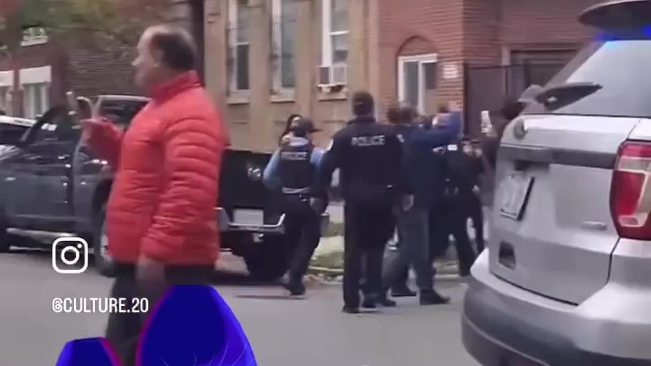 ICE agent can be seen pointing a gun at unarmed neighbors filming, as Chicago PD assists ICE
