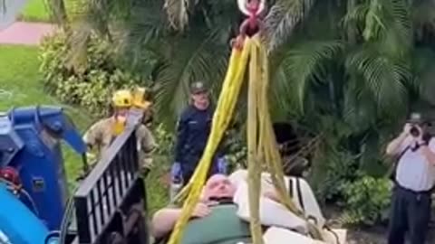 A West Palm Beach fat man had to be lifted by a crane from his apartment