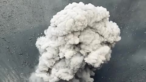 Volcanic ash smoke from inside the crater