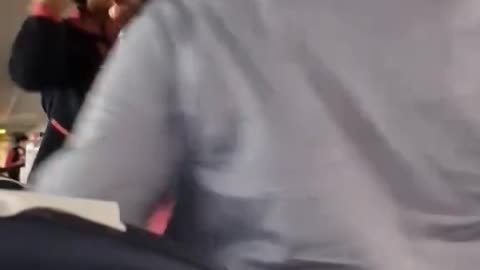 A video of a seemingly intoxicated woman fighting flight crew aboard an aircraft