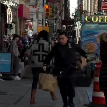 Woman arrested for trying to trip police officer pursuing suspect