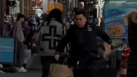 Woman arrested for trying to trip police officer pursuing suspect