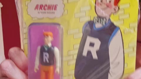 Archie action figure with a football