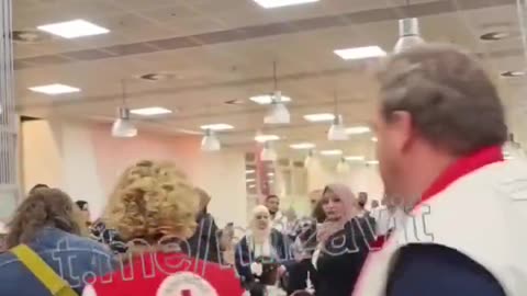 "Refugee" children arrive in Belgium. Complete with clothing depicting assault rifles on them.