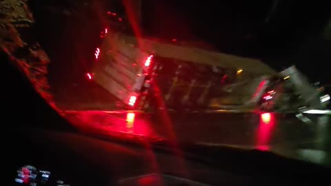 Semi Truck Slides Across Highway in Freezing Rain and Rolls Into Ditch