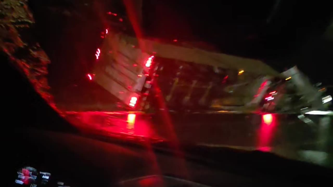 Semi Truck Slides Across Highway in Freezing Rain and Rolls Into Ditch