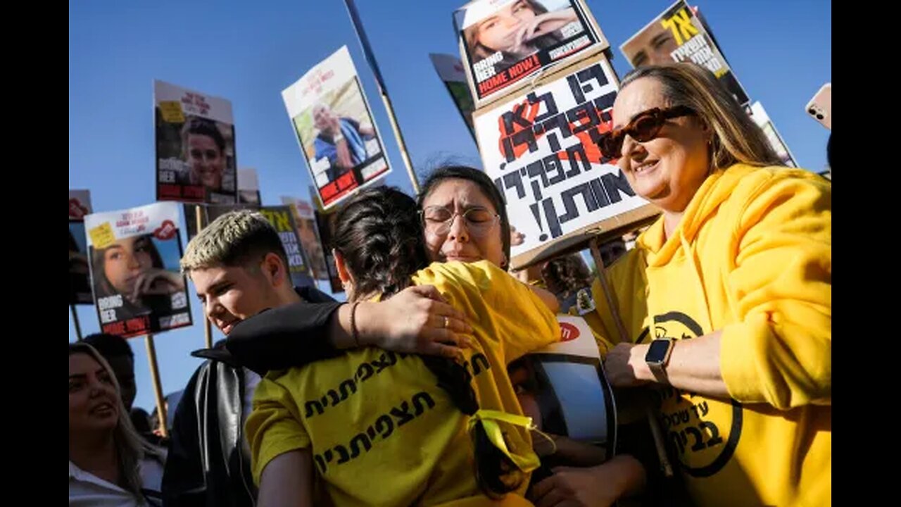 Hamas frees 8 more hostages but Israel puts prisoner release on hold after a chaotic handover