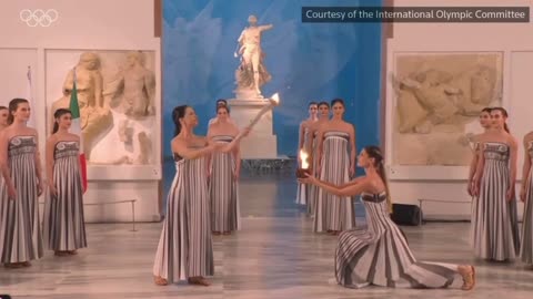 The Olympic flame is lit at the Temple of Hera in Greece and starts its journey to Italy