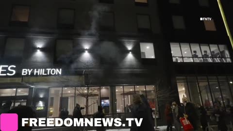 Anti-ICE Protesters are lighting fireworks and blocking cars outside of hotel where