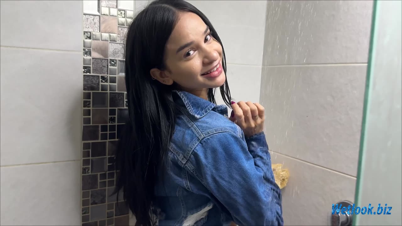 Wetlook girl in shjower in jeans skirt