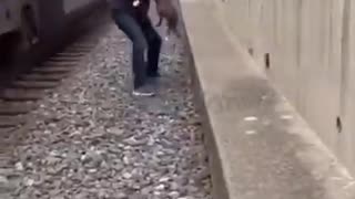 Saving a dog from an incoming train❤️