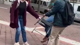Bigoted liberal attempts to steal from street preacher in Philadelphia, Pennsylvania