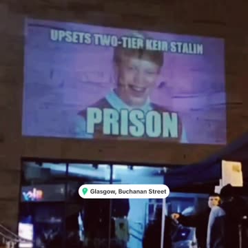 Scottish patriots project a meme mocking two-tier Keir onto a wall in Buchanan