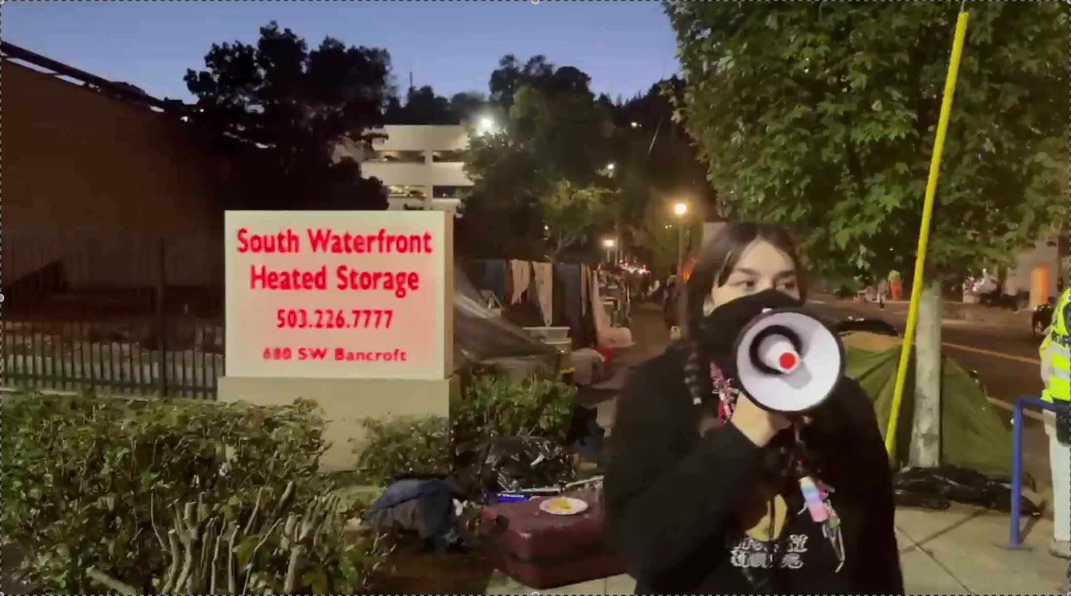 This girl smacking Tommy Bois phone with PortlandPolice just a few feet away,