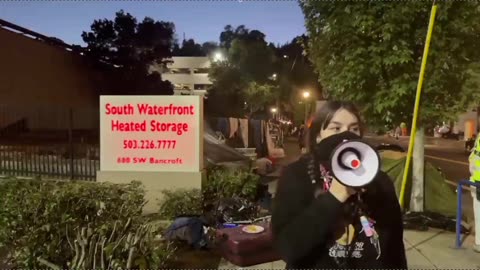 This girl smacking Tommy Boi's phone with PortlandPolice just a few feet away,