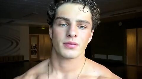 Handsome muscular man showing off his muscles