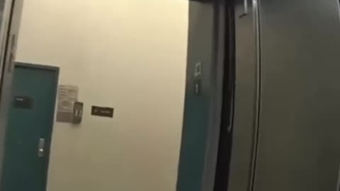 Knife-wielding man lunges at NYPD officers inside apartment building.