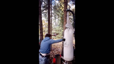 guy hits heavy bag