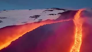 Molten lava flows down the slopes of Mount Etna in Sicily, Italy