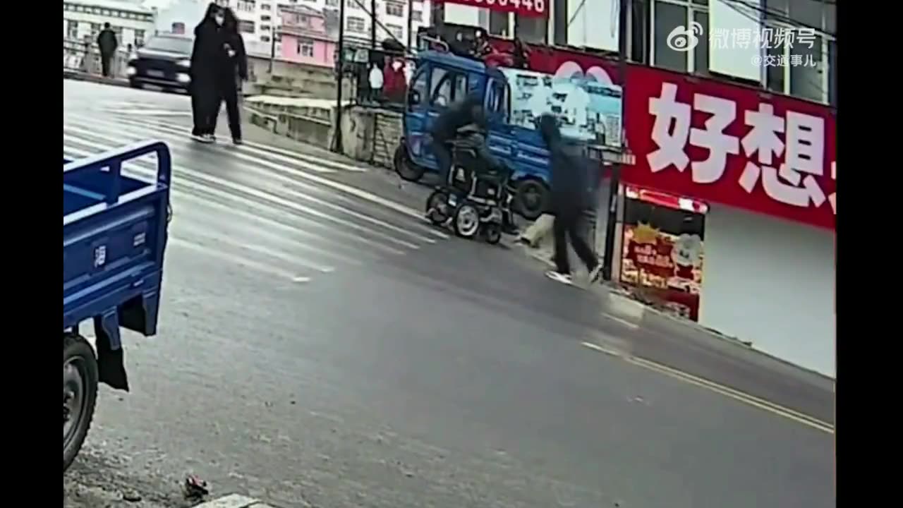 guy trying to walk up icy road