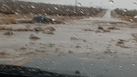 Car Attempts to Cross Floodwater and Gets Swept Away