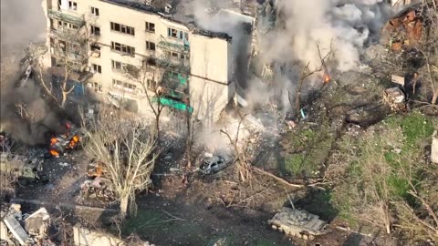 Mariupol Russian army tank obliterates residential building footage of civilians being captured