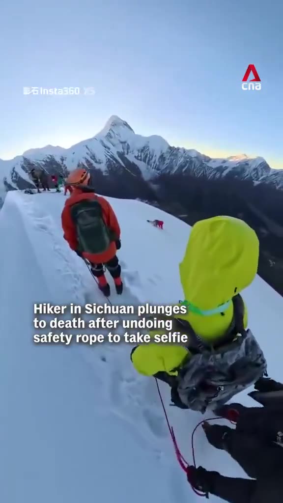 Hiker disconnects safety line for a SELFIE on a mountain top, slides off