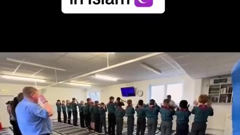 Teaching young non-Muslim children how to perform Islamic prayers.