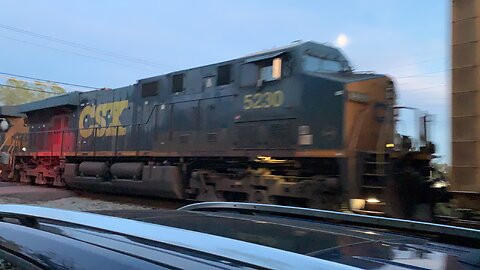 CSX Trains 714 and 5230 with traces of Amtrak behind it