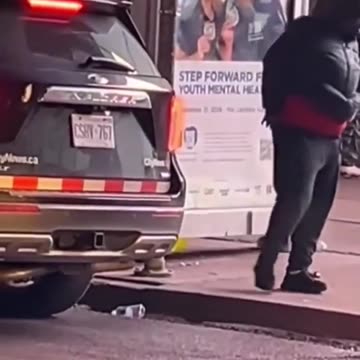 illegal African migrant pooping in public - CANADA