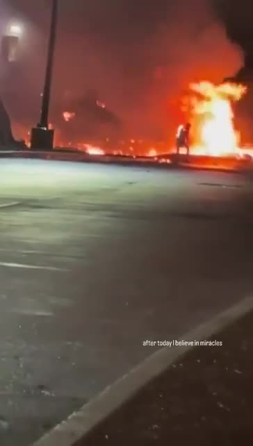 GRAPHIC: Man runs out of the Philadelphia plane crash site while on fire