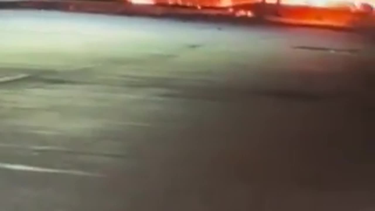 GRAPHIC: Man runs out of the Philadelphia plane crash site while on fire