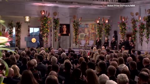 Daughter of Nobel Peace Prize winner accepts prize on her behalf