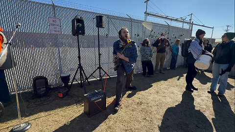 Electric Guitar Player Leads Chants Outside Broadview ICE Facility
