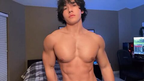 Handsome muscular man showing off his muscles