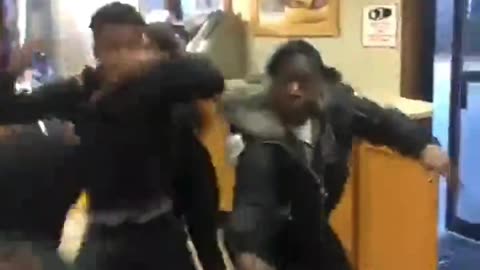 Multifold of people fighting in a Wendy's.