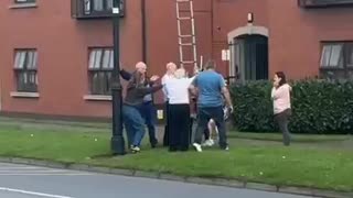A fight breaks out between people who are putting up Irish flags and people who