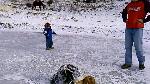 Playing on the frozen pond with William and Myra.