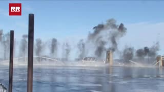 Planned implosion brings down nearly century-old Black Hawk Bridge in Lansing, Iowa.
